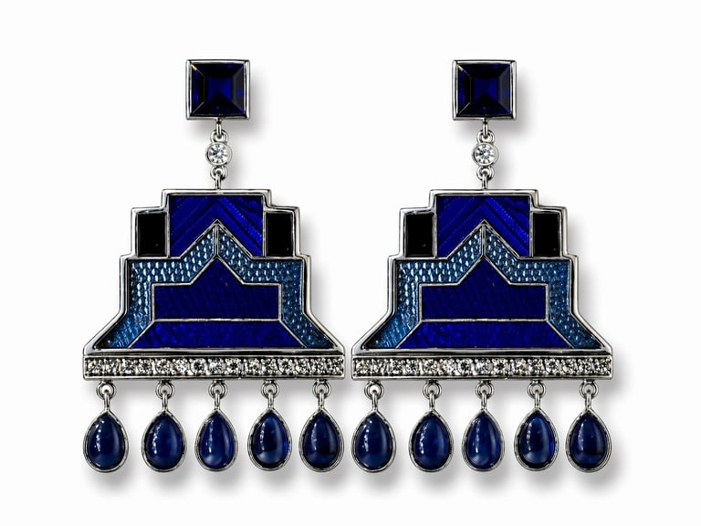 Pair of ornate sapphire and diamond chandelier earrings with geometric blue stone designs and dangling teardrop gems
