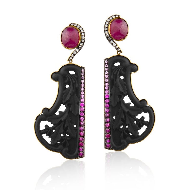 Pair of ornate black carved earrings with pink tourmaline tops and fuchsia gemstone accents