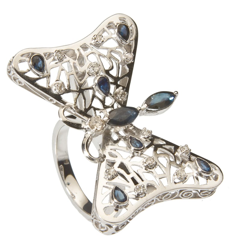 Silver butterfly ring with sapphires and diamonds, featuring intricate filigree wings and ornate design